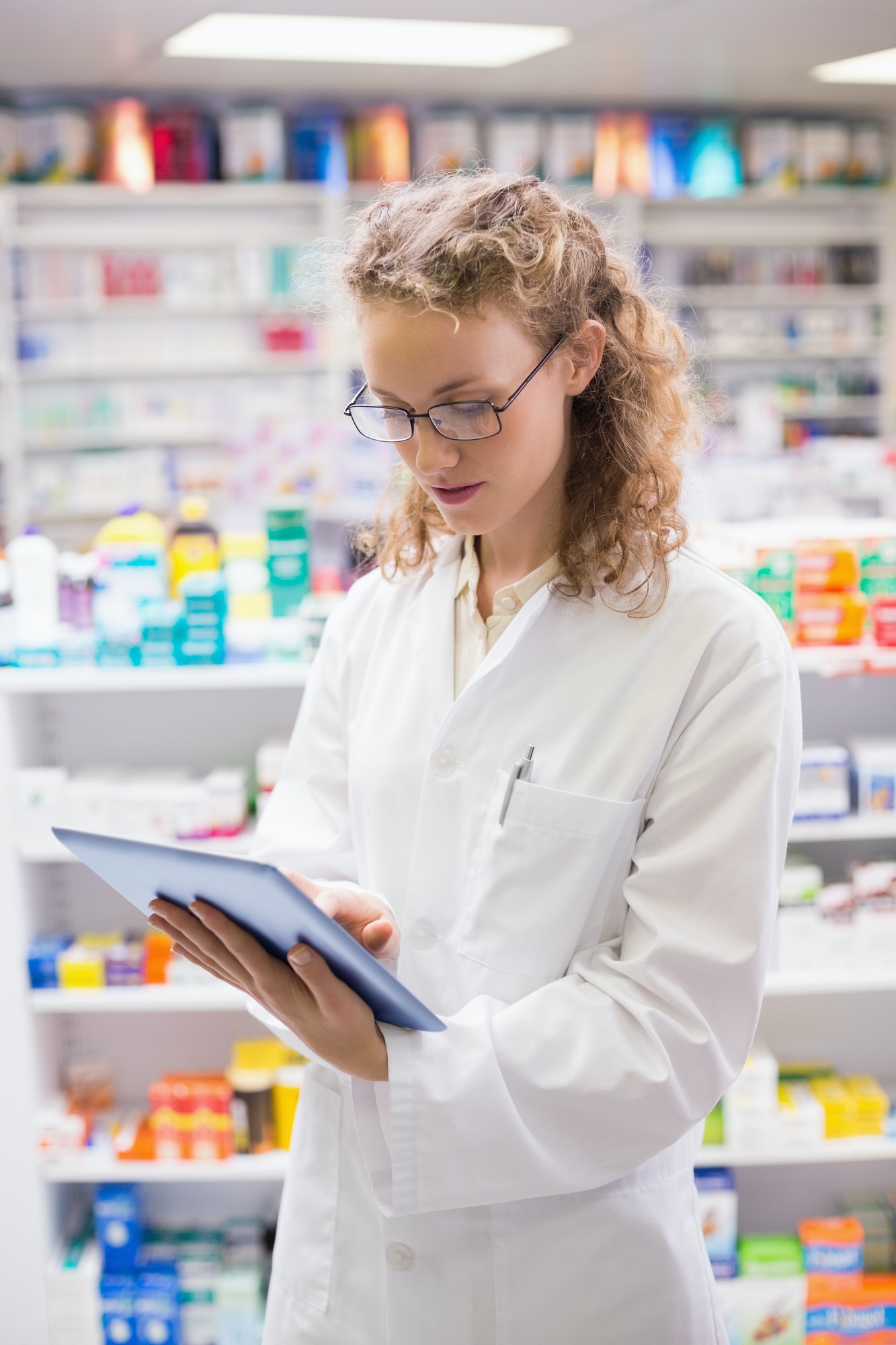 pharmacist using tablet pc at the hospital pharmacy